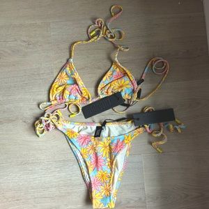 NWT Triangl bikini in perfect condition. Top and bottoms are xs!